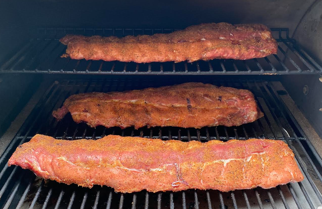 3 racks of ribs on the smoker