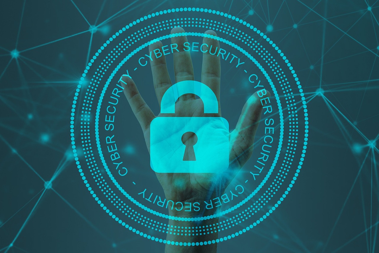 A digital image of a hand behind a padlock icon with the words "CYBER SECURITY" encircling it, set against a network of connected nodes.