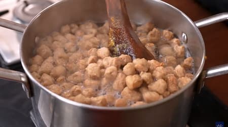 Soya chunks being boiled in a pot of water to become soft and fluffy.