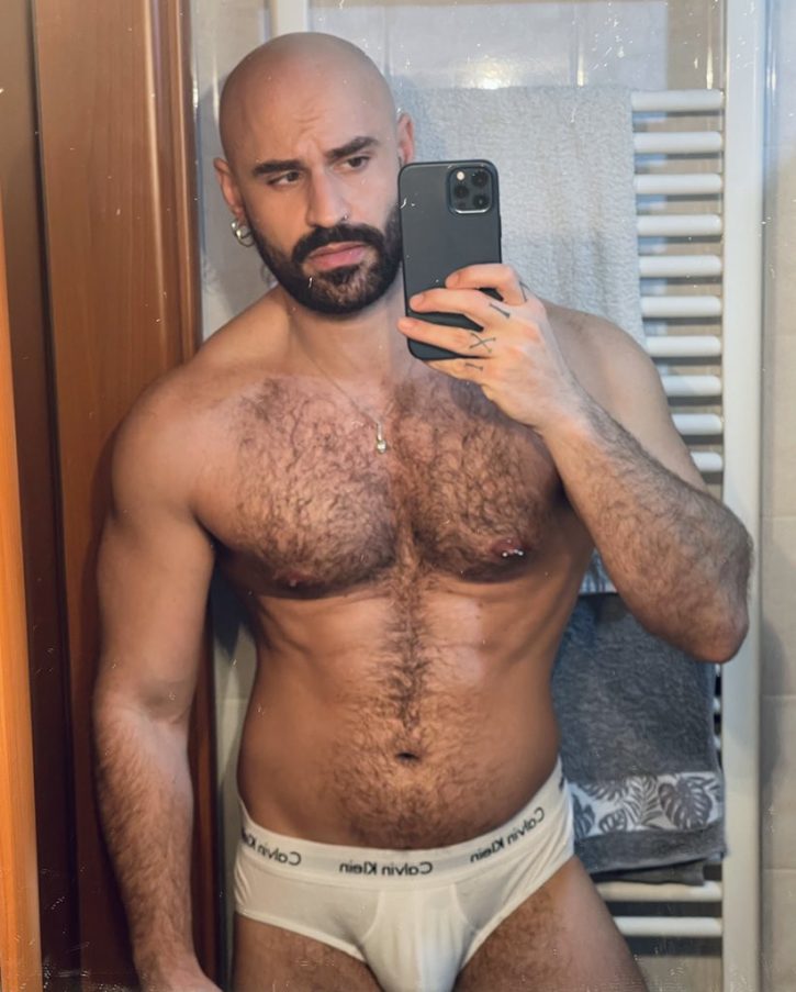 Mister Caccamo taking an iphone mirror selfie in white loose calvin klein underwear briefs for gay xxx onlyfans content photos