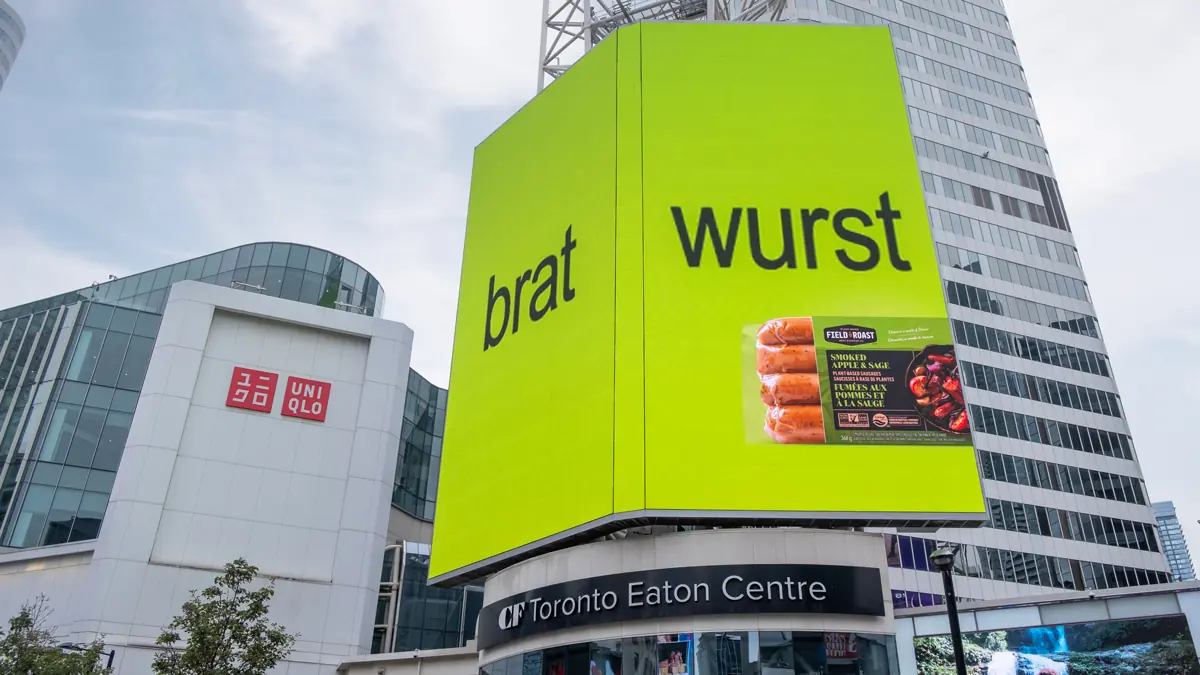 A billboard in Toronto it’s all the same lime green as the brat album cover but says “brat wust” with a photo of Field Roast’s sausages on it.  