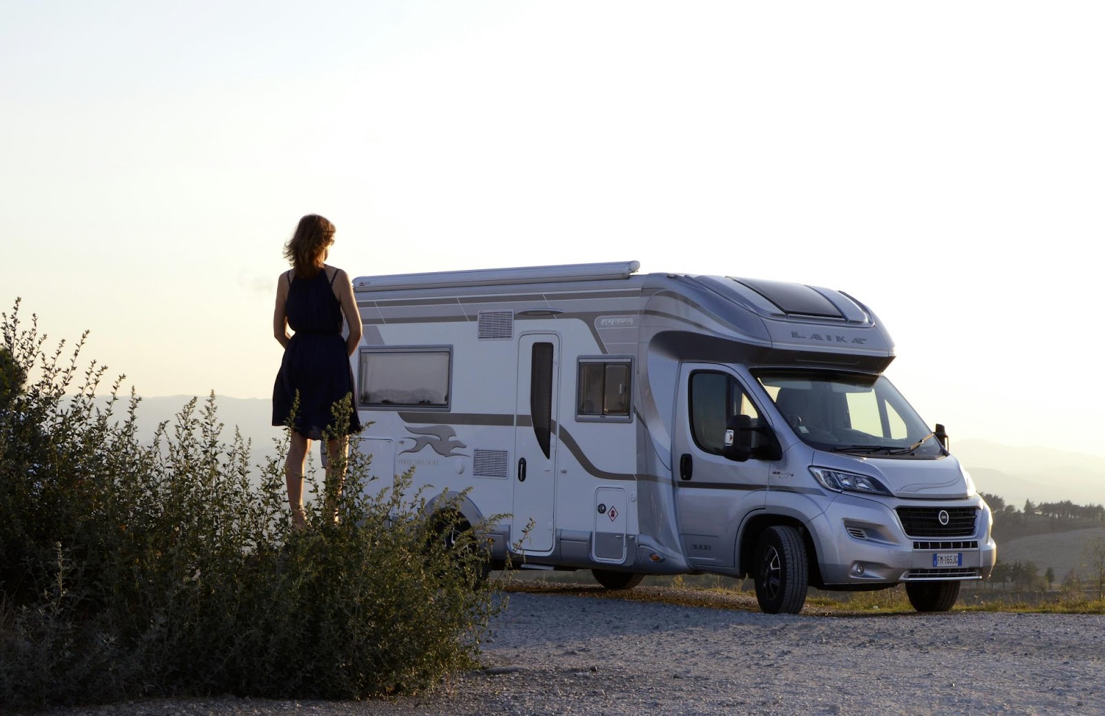 a man standing next to a white van