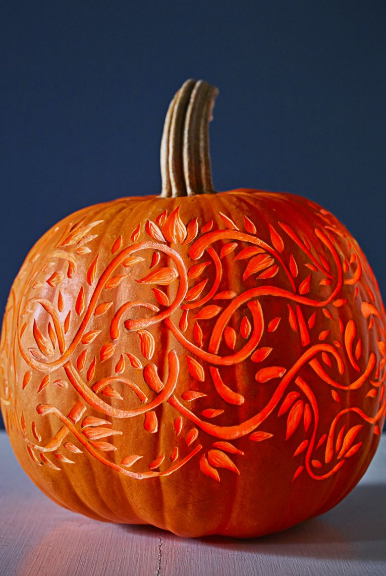 pumpkin carving ideas twisting vines carved into a pumpkin