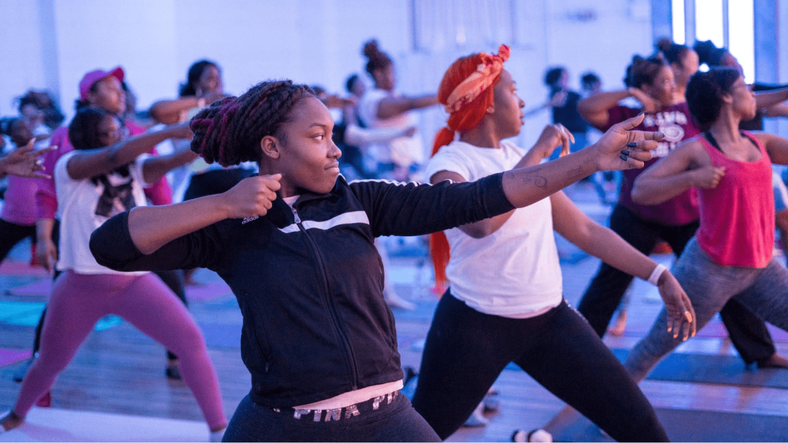 Women in room doing yoga