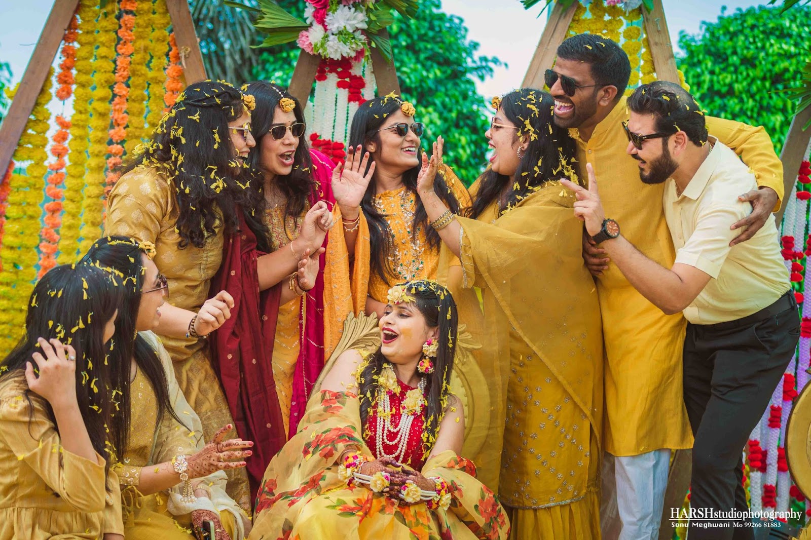 best photographer in Indore - Harsh Studio Photography : Bridal party posing with vibrant flowers