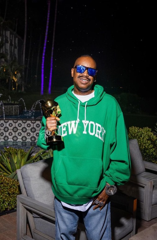 Slick Rick with an Award