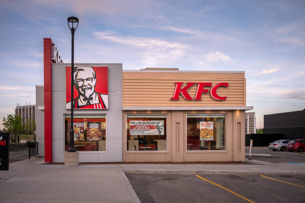 KFC store, Calgary Calgary, Alberta - May 30, 2021:  Exterior facade of a KFC restaurant in Calgary, Alberta. kentucky fried chicken stock pictures, royalty-free photos & images