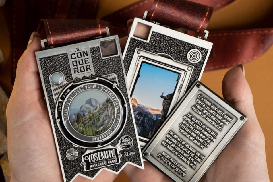 Close up images of the front and back of the Yosemite National Park Virtual Challenge Conqueror medal.