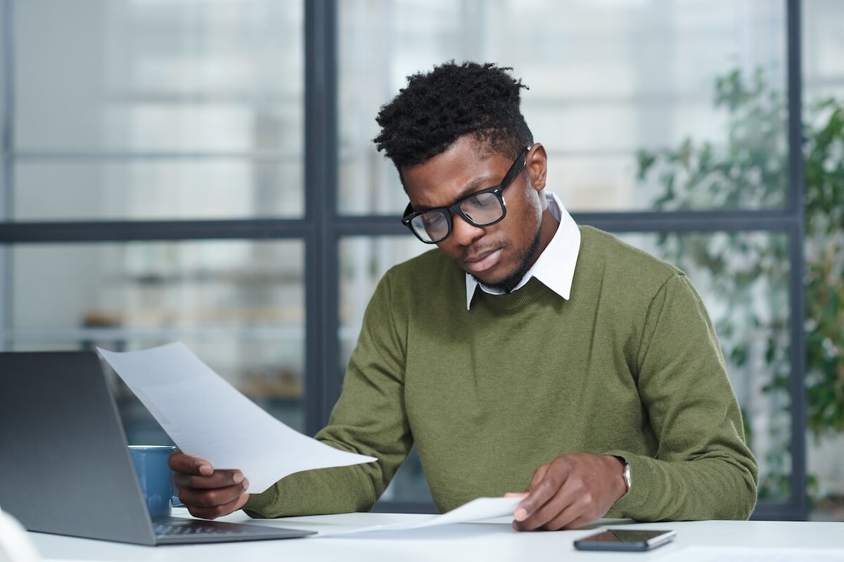 Claims management system: employee looking at some documents