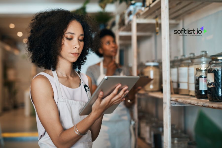 Woman with tablet checking inventory in a store.