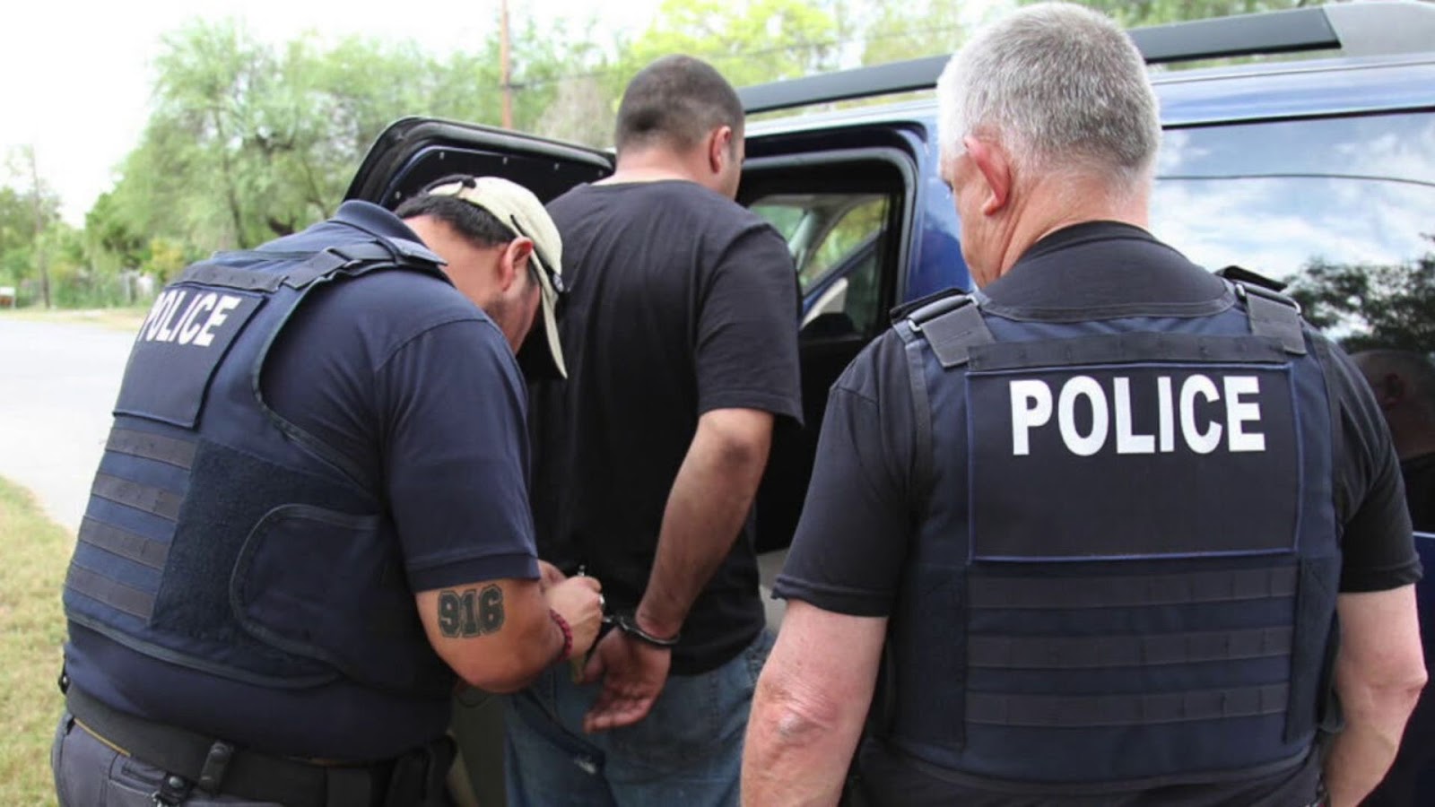 policemen arresting a man