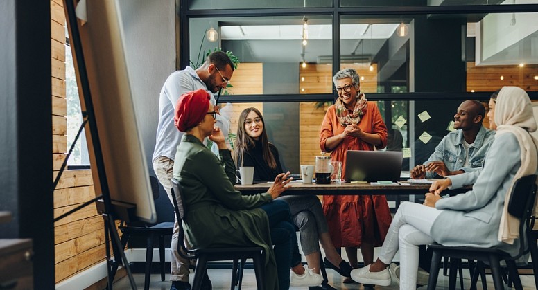 diverse coworkers sitting round a table