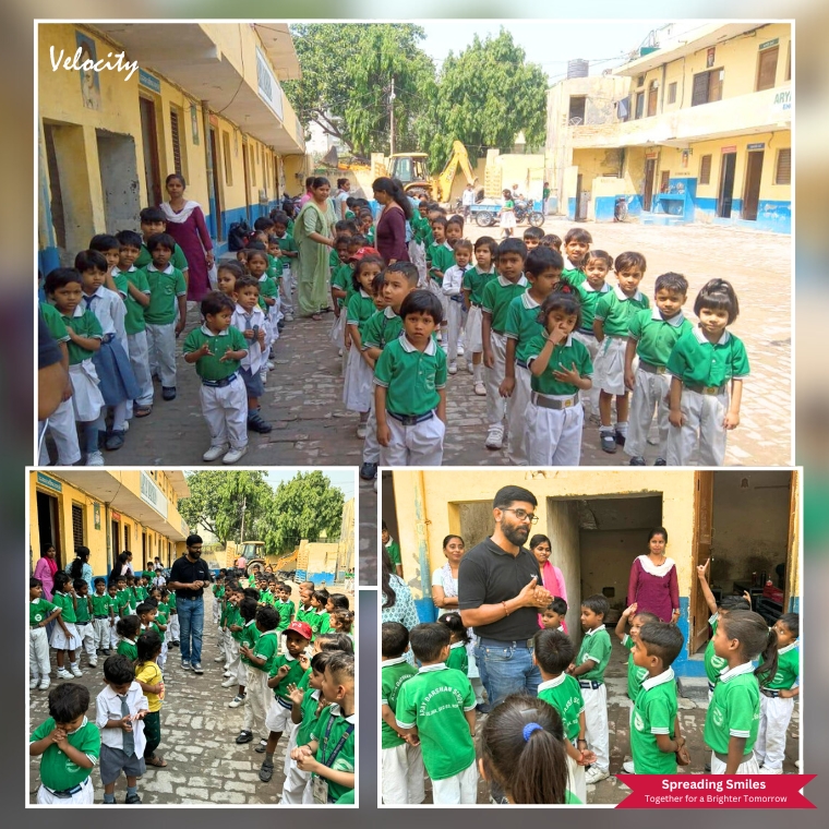 Joyful interaction with students and staff during a School visit organized by Velocity