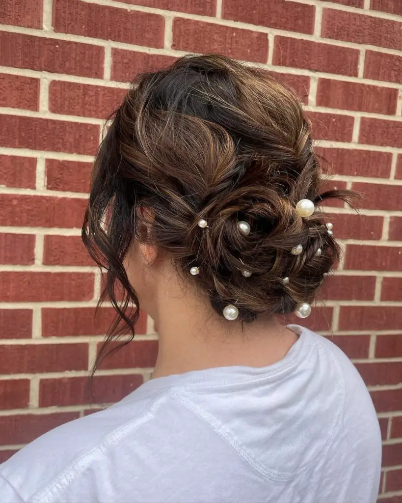 Picture of a lady wearing a Messy Bun with Pearl Accents