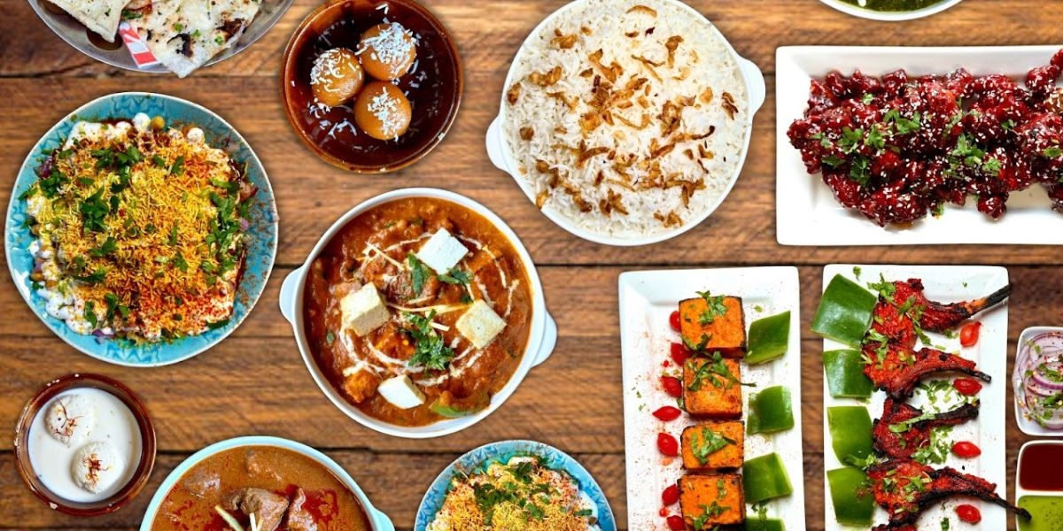 A table with various plates of food arranged neatly.