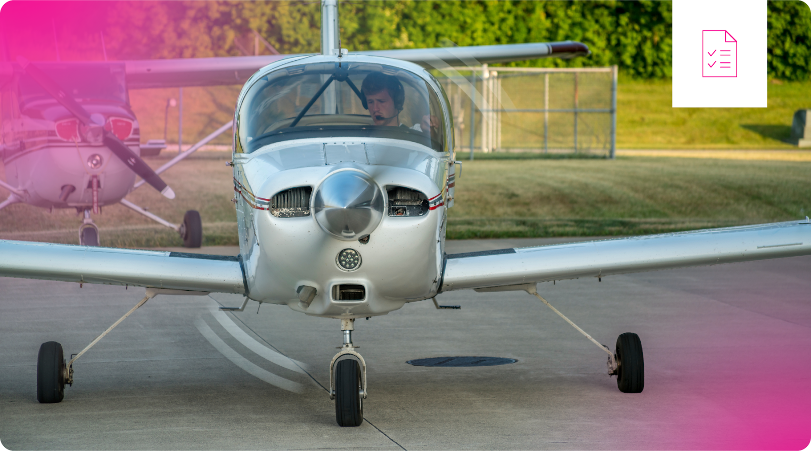 A pilot sits in the cockpit of a single-engine light airplane.