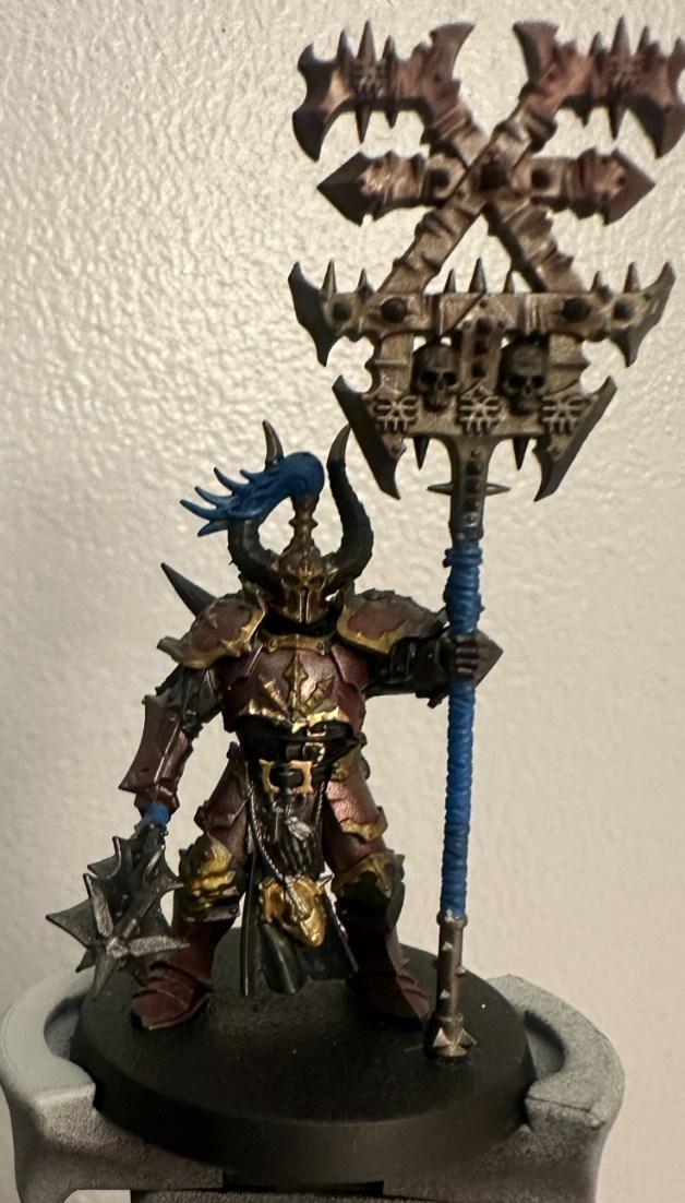 A toy figure holding a spear Description automatically generated