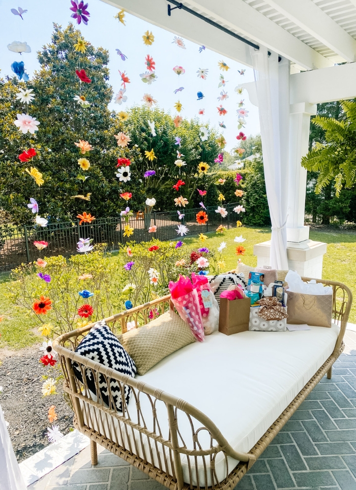 flower streamers behind outdoor couch