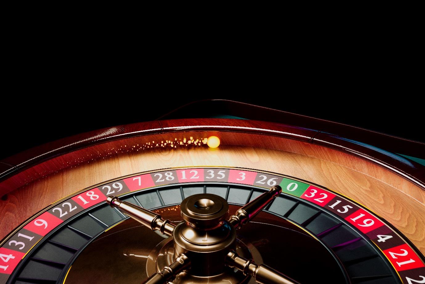 A roulette wheel with a ball in the center  Description automatically generated
