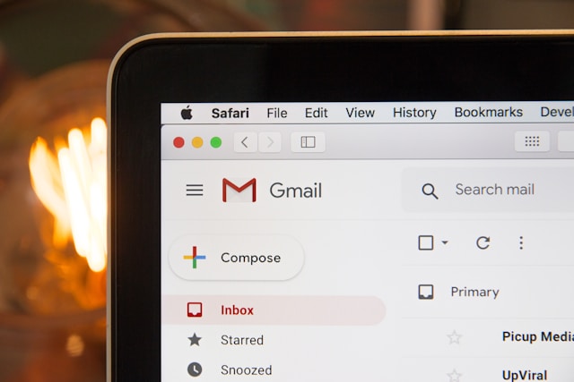 Image of laptop showing Gmail home page.  