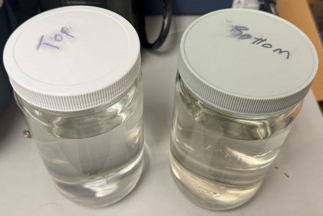 Contaminated Ethyl Acetate samples from the top and bottom of a large storage vessel