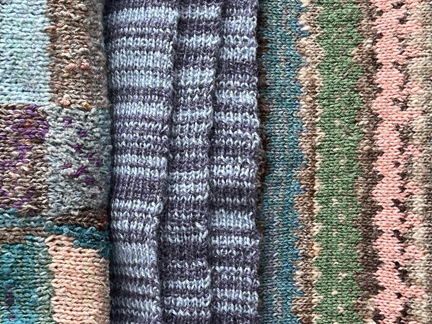 A close up of a pile of knitted fabric

Description automatically generated