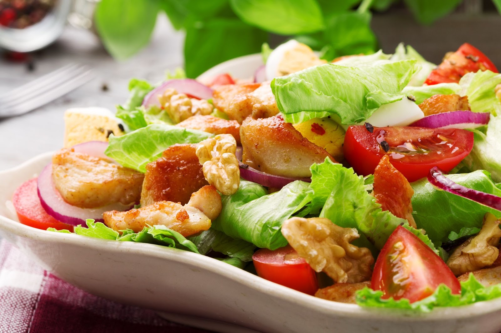 A close-up image of a protein-rich grilled chicken salad.