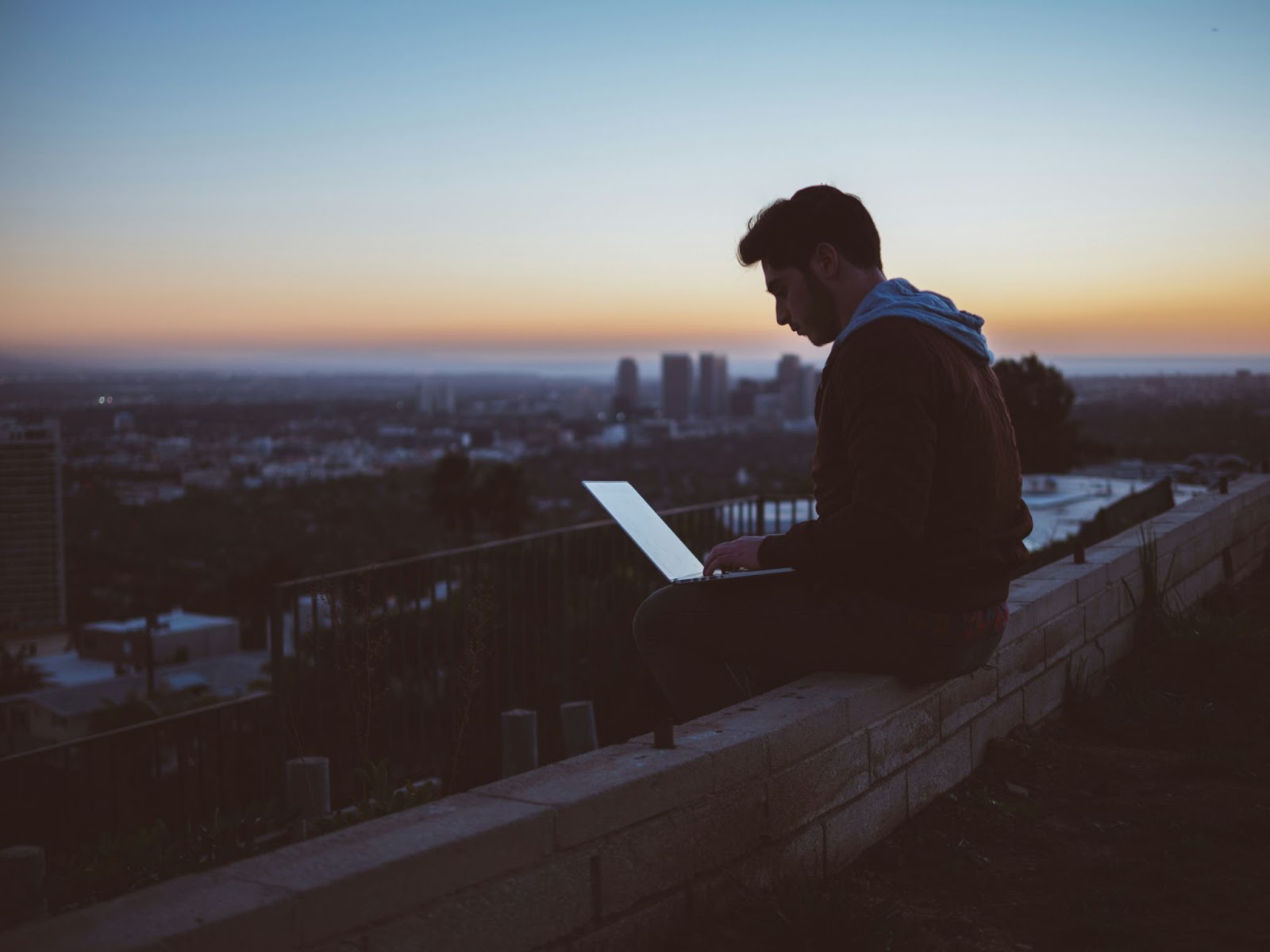 Young man working on the roof of a building