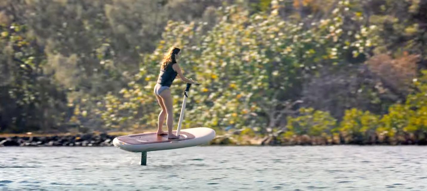 A person on a paddle board

Description automatically generated