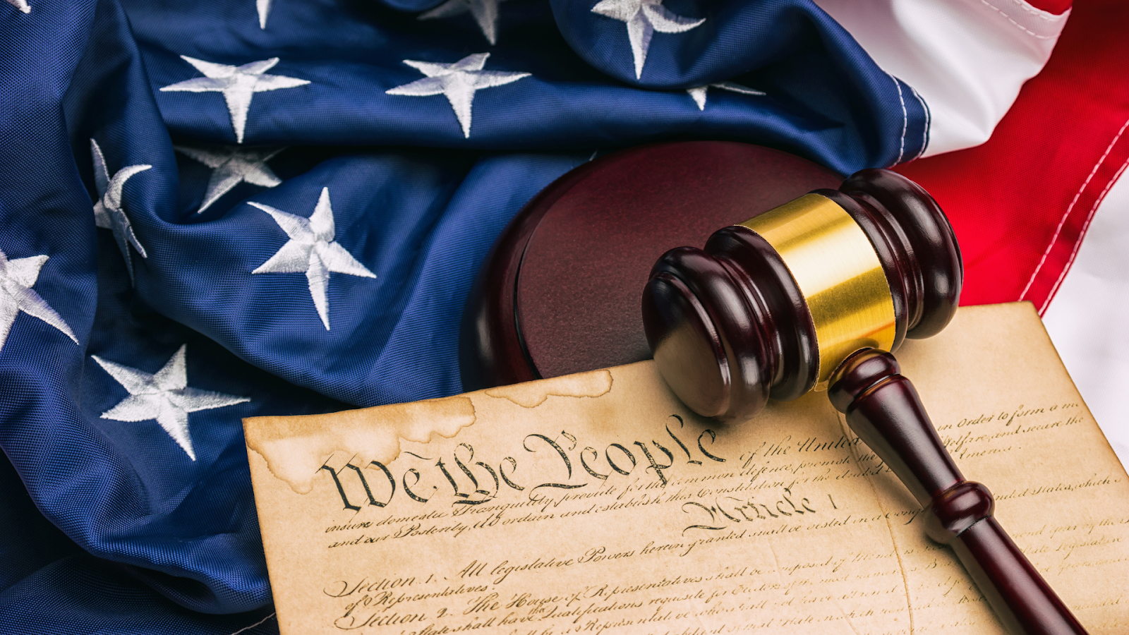 a gavel placed on a document and american flag