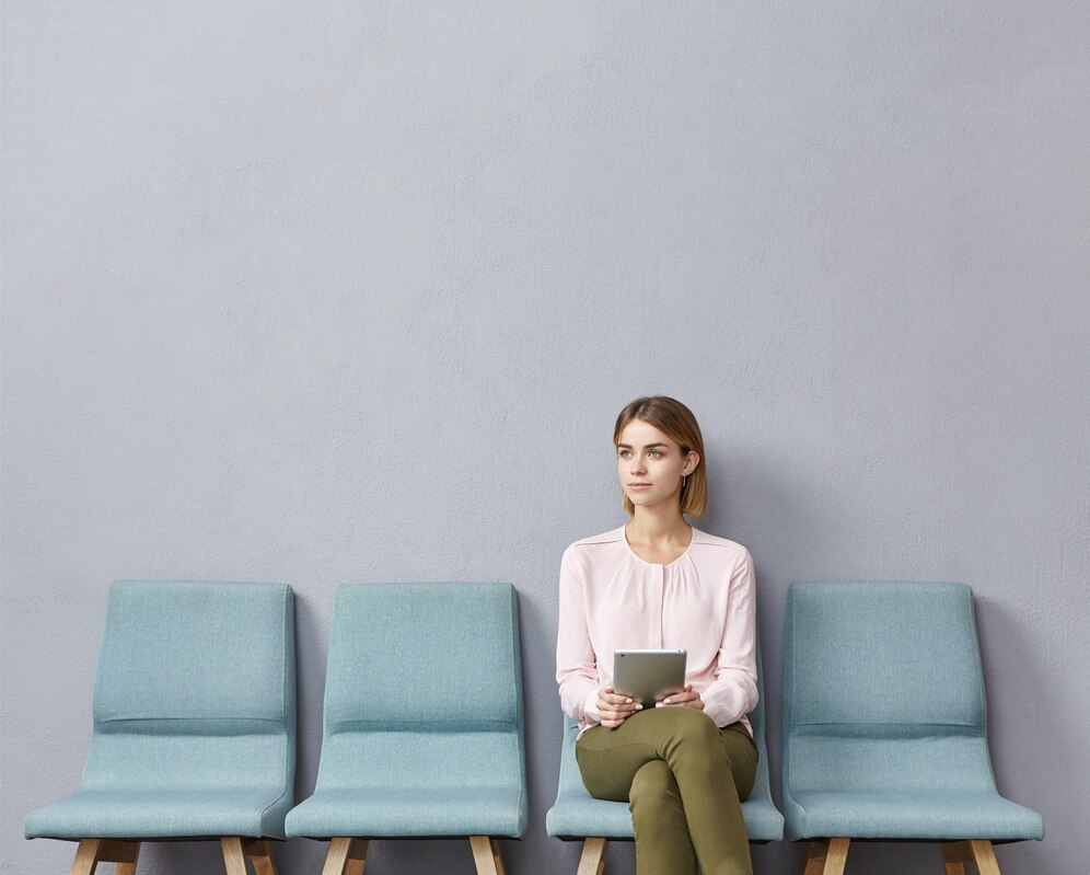 a woman sitting on chairs