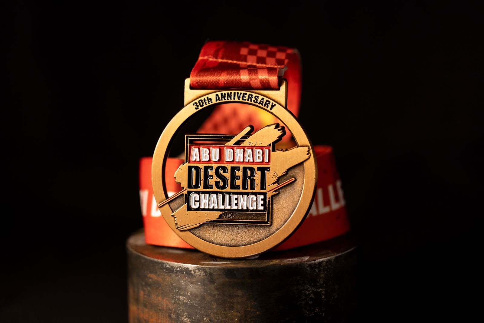 Custom medal for Abu Dhabi Desert Challenge with cut out.