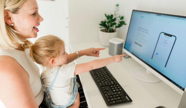 A person and a child looking at a computer screen

Description automatically generated