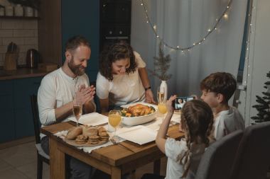 tips to choose the right flooring for your home remodel family enjoying dinner together in kitchen custom built michigan