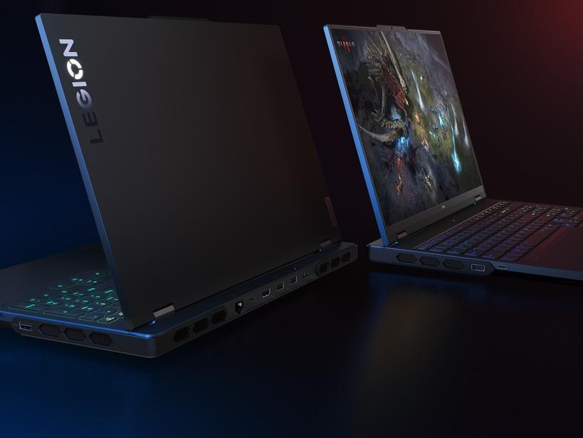 A couple of laptops on a table

Description automatically generated