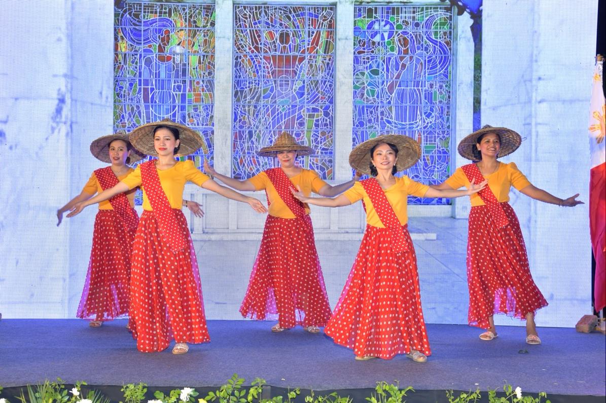 A group of women dancing on a stageDescription automatically generated