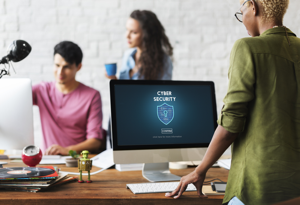 employee looking at cybersecurity software on their computer