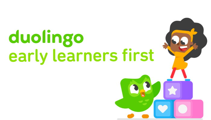 Illustration of young Bea on top of colorful building blocks. Duo is smiling and reaching a wing to her. Text to the left of the image reads “duolingo early learners first”
