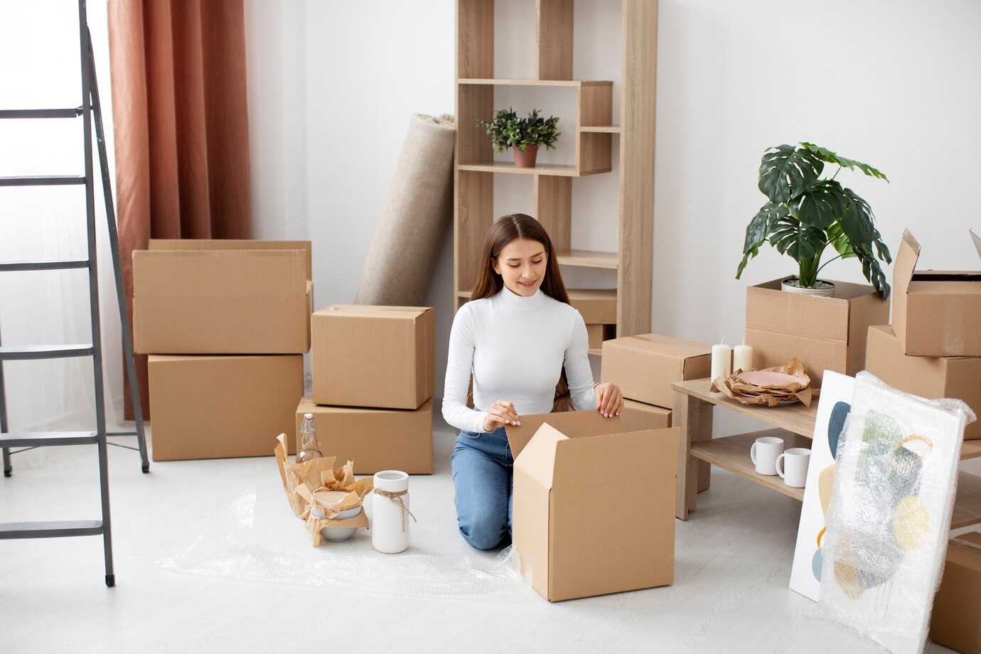 a woman in a room with boxes around
