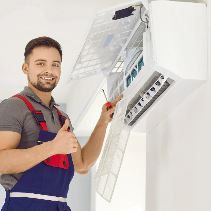 man helping customers with hvac system