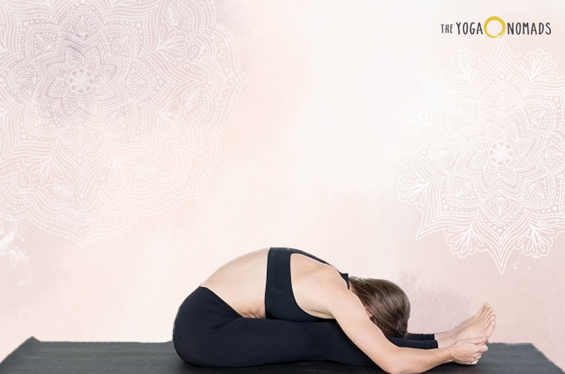 woman doing the seated forward bend pose