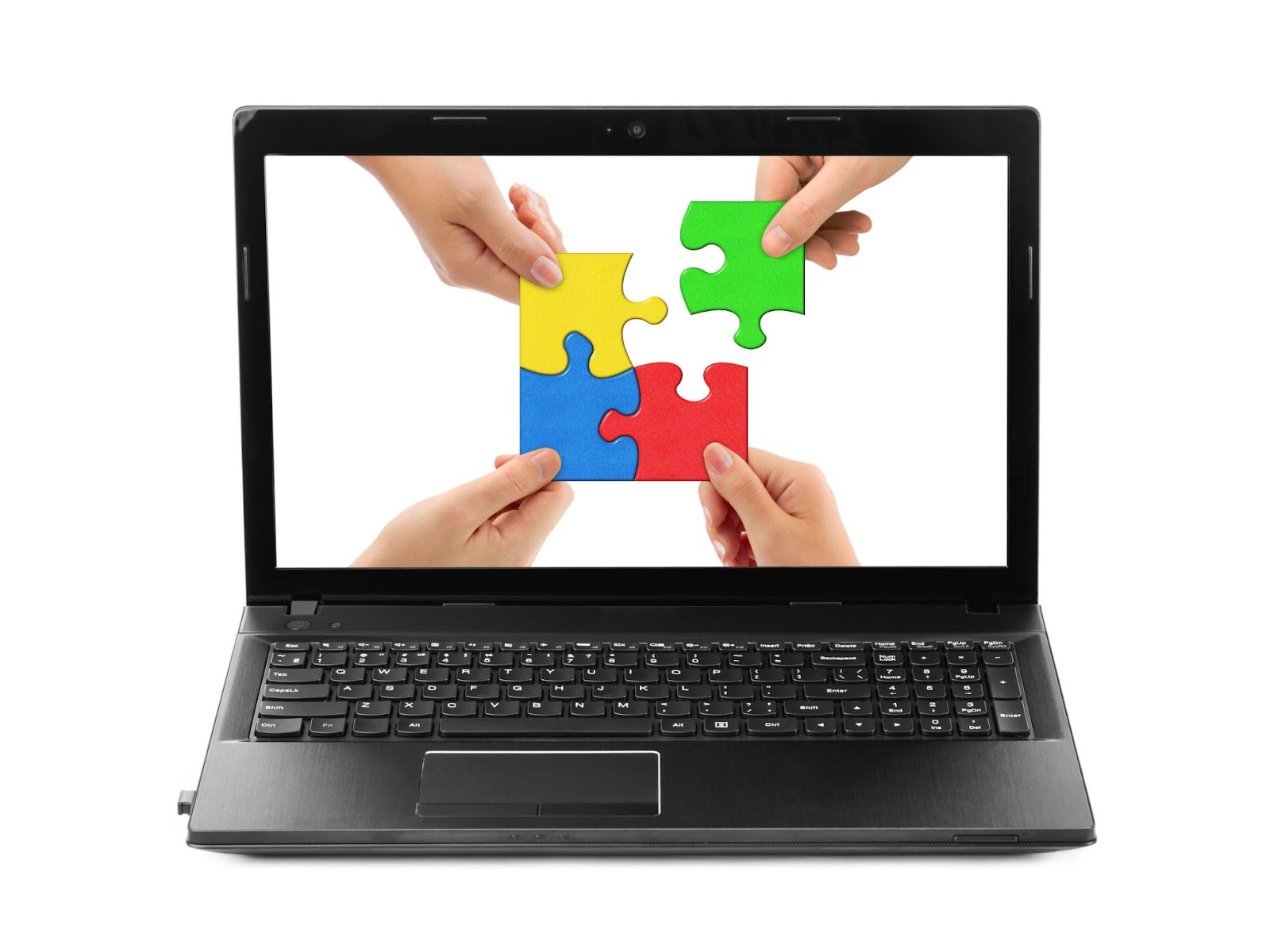 A laptop screen displays an image of four hands each holding a piece of a colorful jigsaw puzzle, fitting them together, emphasizing the teamwork needed to solve puzzles.