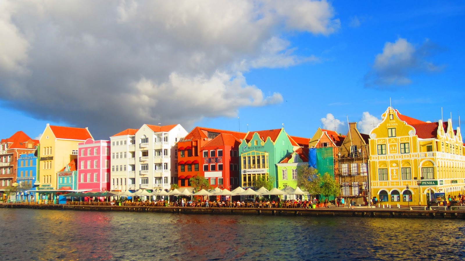 Pastel -colored buildings along the shore.