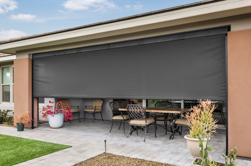 Back porch solar shade covering living space