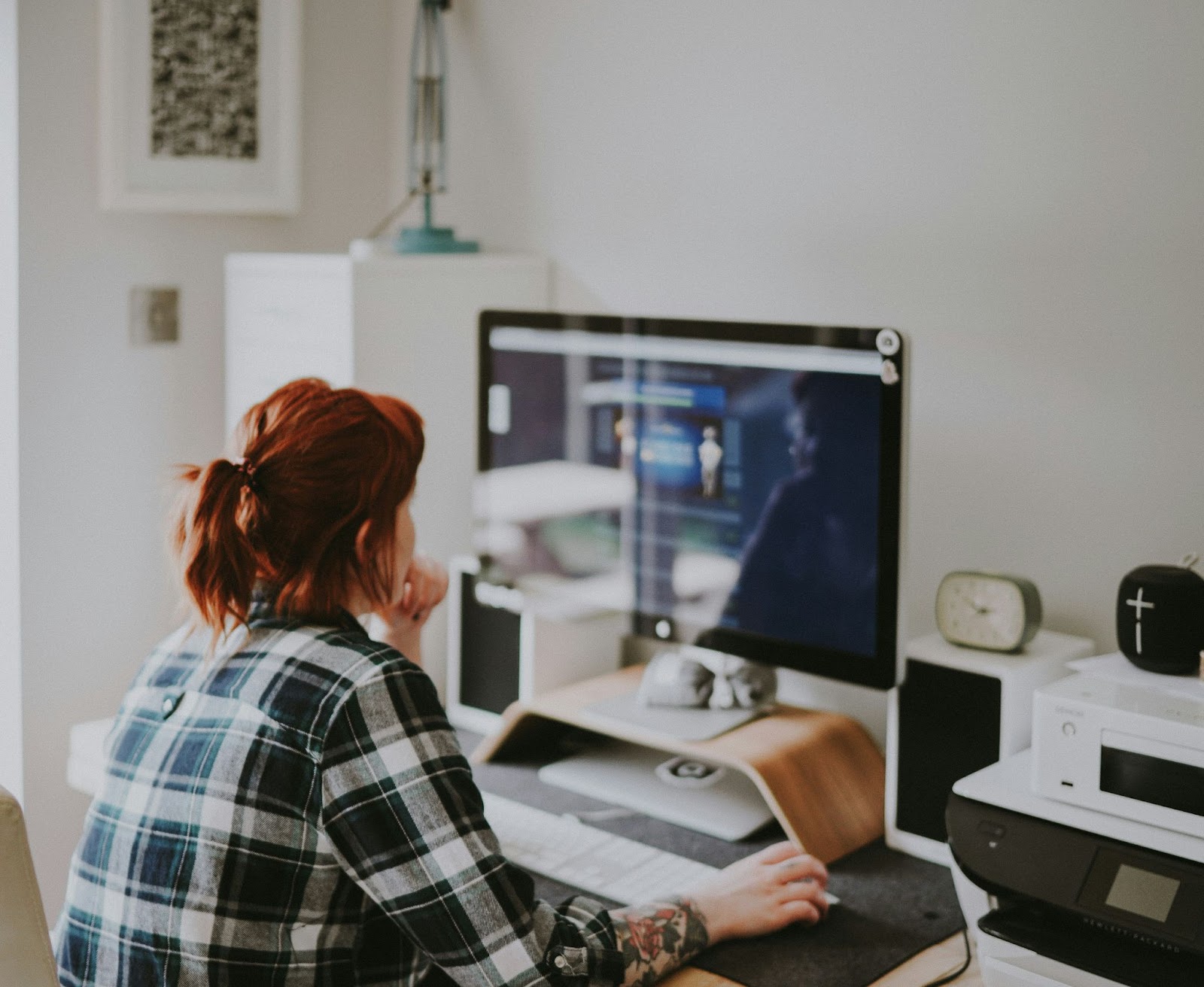 Woman browsing on her desktop computer