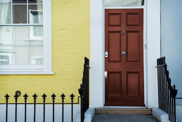 Front view of front door with blue and yellow wall