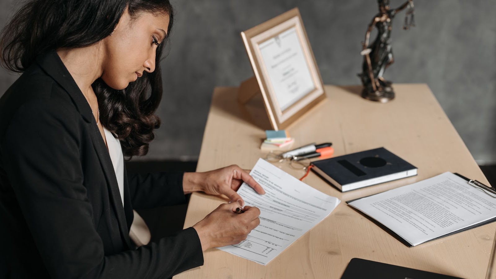 person signing a legal document