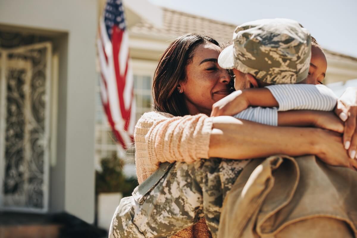 Military leave: soldier hugging his family