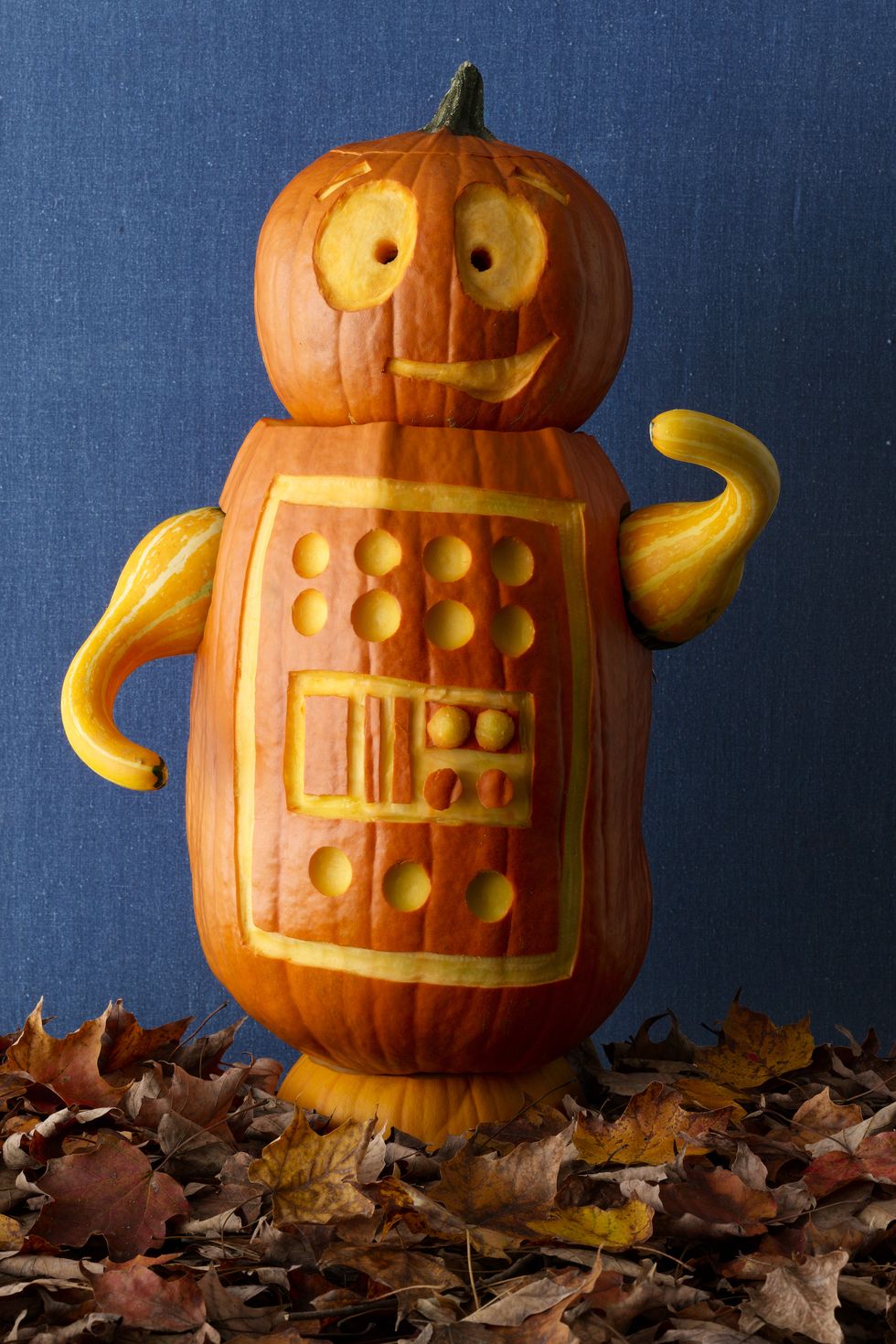 pumpkin carving ideas, two stacked pumpkins with a robot design