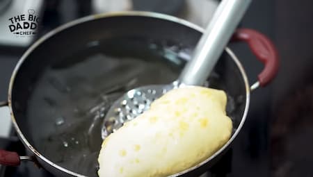 Making dough and frying fluffy bhature in hot oil for Authentic Choley Bhature.